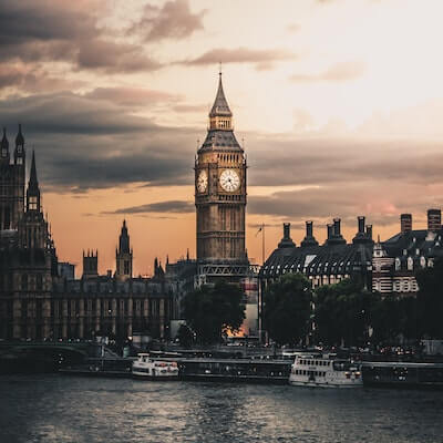Sunset over the river thames with a view of the elizabeth tower (commonly known as big ben) and the houses of parliament in london.
